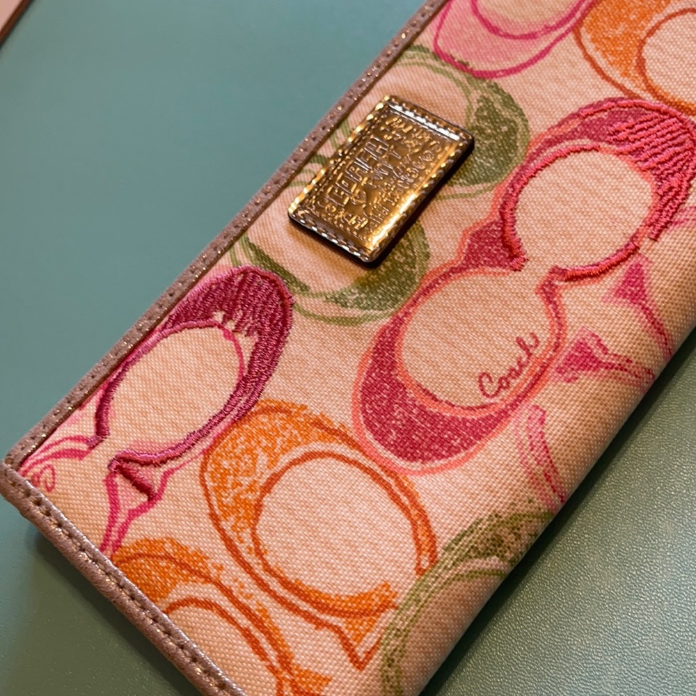 Coach Poppy zip around slim wallet.